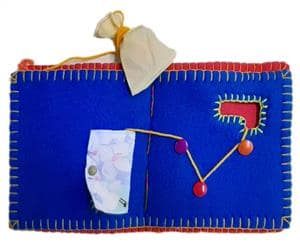 جلد کتاب کتاب پارچه‌ای نخ و سوراخ